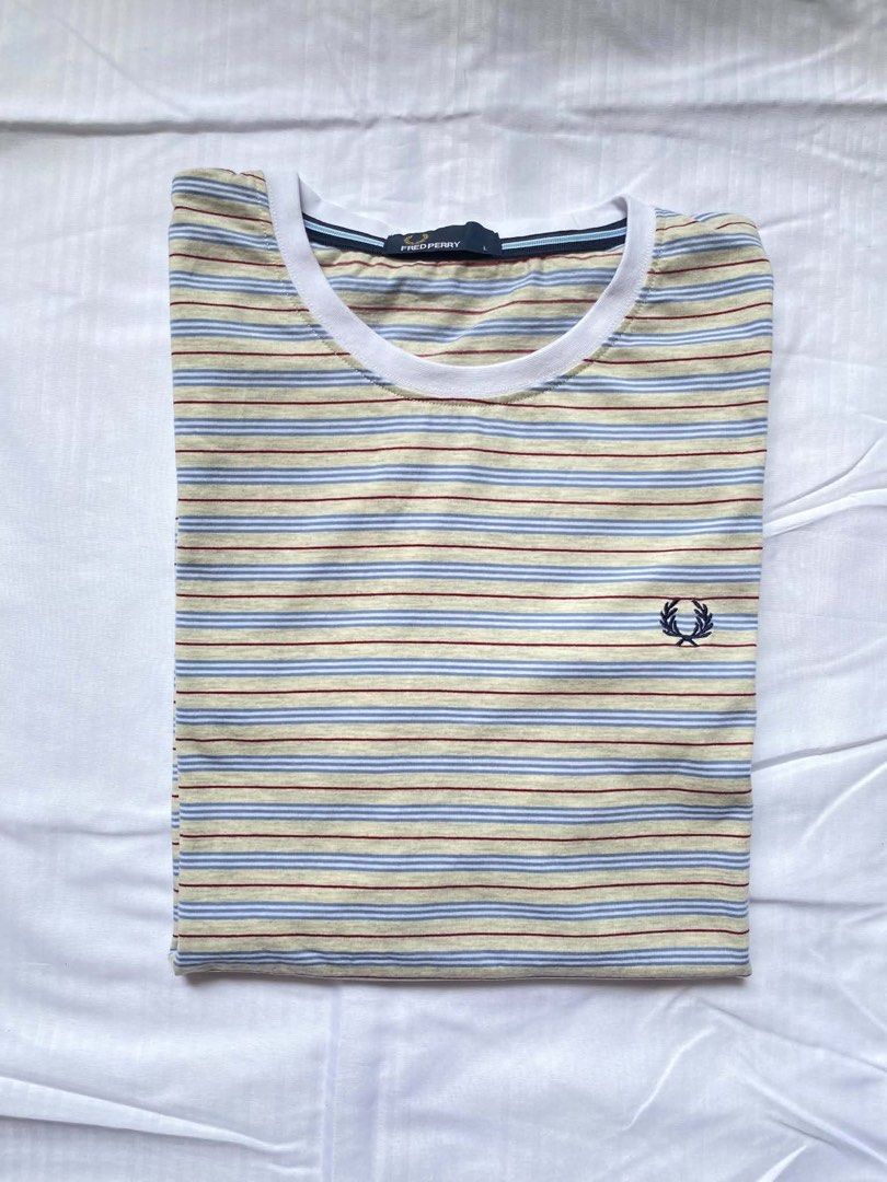 Fred Perry Striped T-shirt - Size L (Category: Tshirts & Polo Shirts ) located in Iligan City. Submitted by brandx1993 (Listing ID 1436351244, Image 1). Description: - Fred Perry striped t-shirt - Size: L - Crew neck - Embroidered navy blue laurel wreath logo - Striped pattern: beige, blue, and maroon - White collar -Excellent Condition 10/10 Large 21-21.5/28.5.