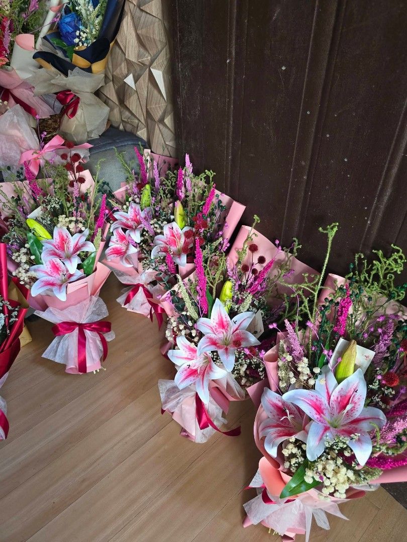 Fresh Lily Flower Bouquet (Category: Flowers & Bouquets) located in Bulacan. Submitted by snifftogo (Listing ID 1436413430, Image 1). Description: - Combination of Artificial and Dried flower bouquets - Features lilies and other colorful flowers - Wrapped in pink paper - Tied with a ribbon - Ideal for gifts or home decor - Multiple pieces available - Ready for delivery via Lalamove .