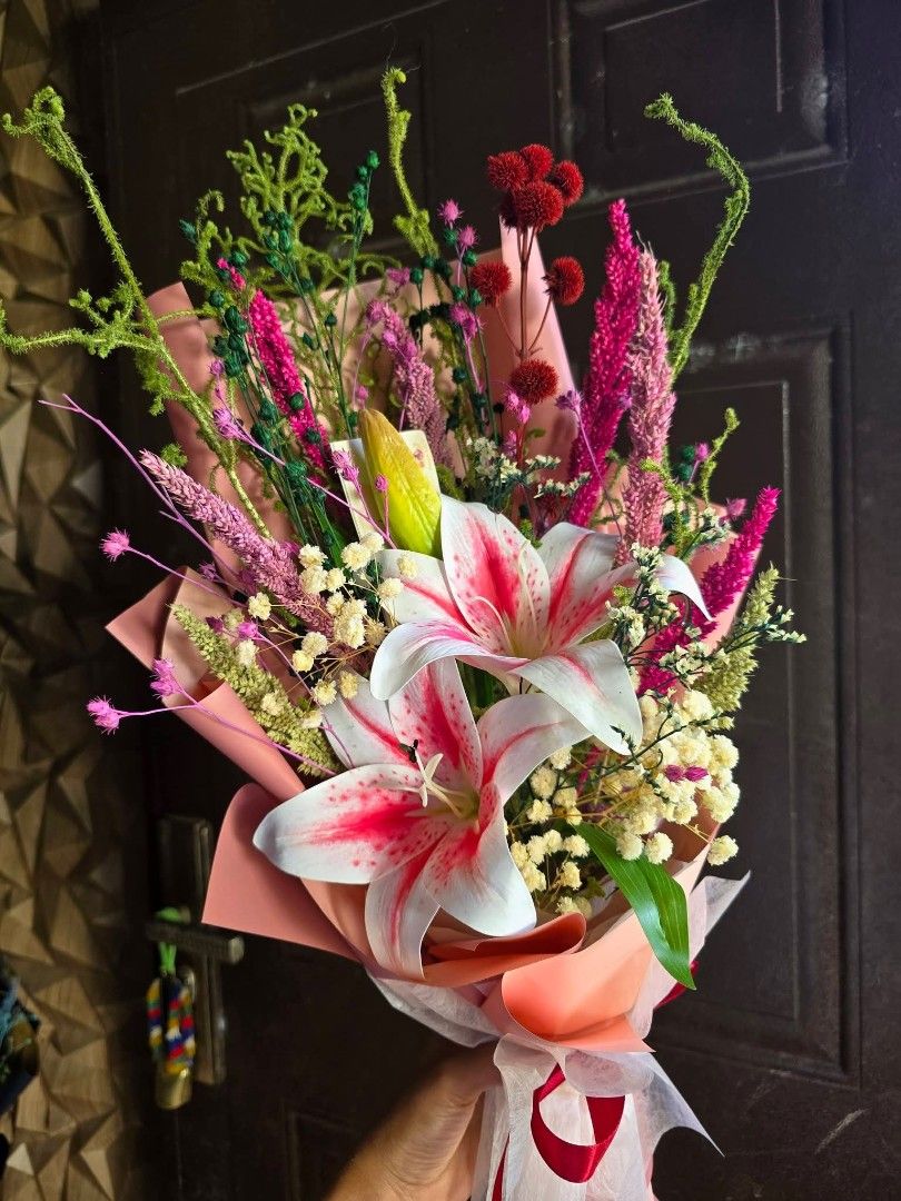 Fresh Lily Flower Bouquet (Category: Flowers & Bouquets) located in Bulacan. Submitted by snifftogo (Listing ID 1436413430, Image 2). Description: - Combination of Artificial and Dried flower bouquets - Features lilies and other colorful flowers - Wrapped in pink paper - Tied with a ribbon - Ideal for gifts or home decor - Multiple pieces available - Ready for delivery via Lalamove .