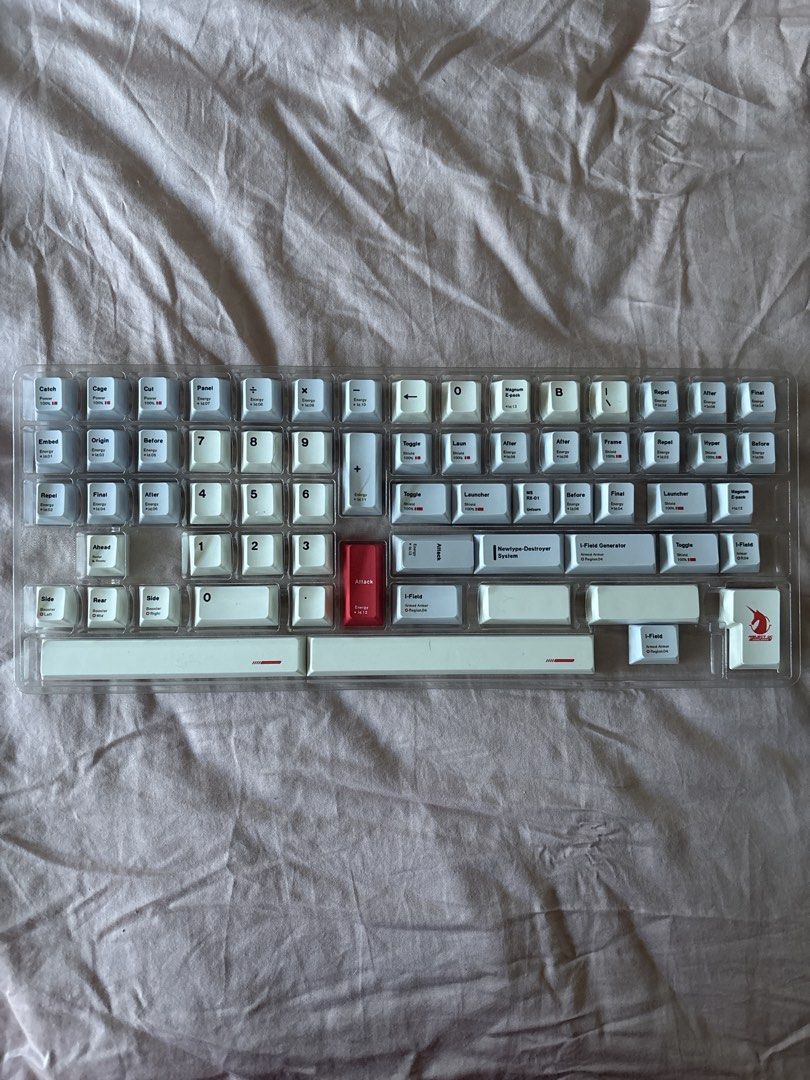 Full keycaps set (60% until 100% model keyboard) (Category: Computer Keyboard) located in Manila. Submitted by rosemarywstn (Listing ID 1436378083, Image 3). Description: - White and grey keycap set - Complete set with various sizes and layouts (60% until 100%) - Includes different accent colors (orange, green, red) - Brand new and fresh out the box - Keycaps arranged in a clear plastic tray.