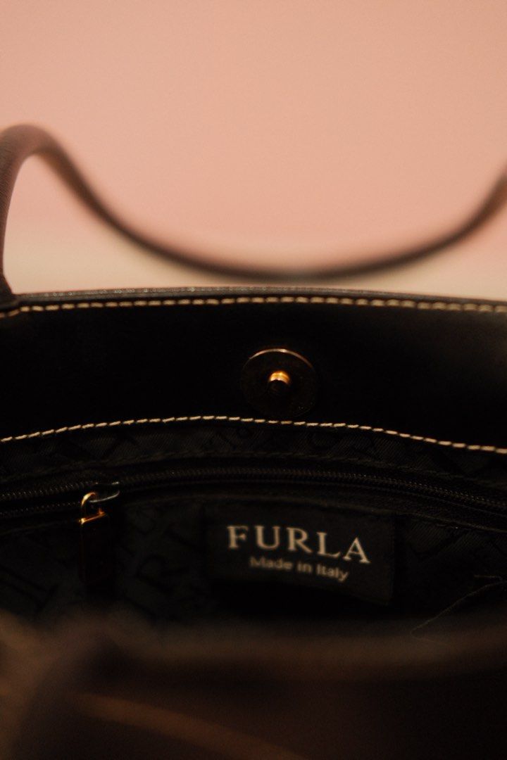 Furla Black Leather Tote Bag (Category: Luxury Bags & Wallets) located in Manila. Submitted by jeanjavina43389 (Listing ID 1436400048, Image 2). Description: - Furla black leather tote bag - Classic design - Gold-tone detail - Made in Italy - Interior zipper pocket - Magnetic closure - Perfect for everyday or special occasions -Leather is so good!! My faveee!.