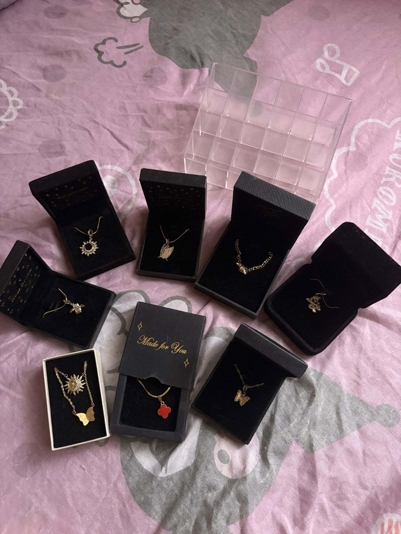 Gold-toned Pendant Necklaces (Category: Necklaces) located in Antipolo. Submitted by bdgt_3 (Listing ID 1436365427, Image 1). Description: Various gold-toned pendant necklaces. Designs include a sun, butterfly, flower, and clover. Each necklace comes in a black box, some with the words "Made for You". The necklaces appear to be new and unworn. Perfect for adding a touch of elegance to any outfit..