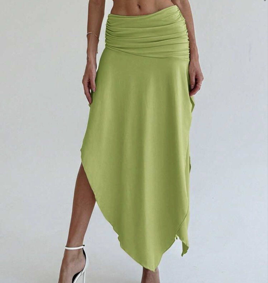 SHEIN Green Asymmetrical Midi Skirt (Category: Skirts) located in Quezon City. Submitted by infinitaeee (Listing ID 1436357630, Image 1). Description: USED ONCE rfs: too big on me og price: 600 - Stylish green midi skirt - Asymmetrical hemline - Ruched waist detail - Lightweight fabric - Flattering silhouette - Perfect for casual or dressy occasions.