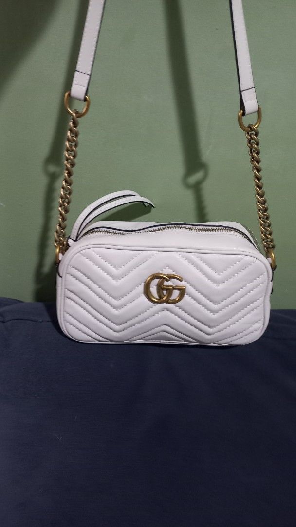 Gucci GG Marmont Mini Bag (Category: Luxury Bags & Wallets) located in Manila. Submitted by luckyrabbit.25 (Listing ID 1436303123, Image 3). Description: - Authentic Gucci GG Marmont mini bag - Color: White - Chevron pattern - Gold-tone GG logo - Chain strap - Beige lining - Zip closure.