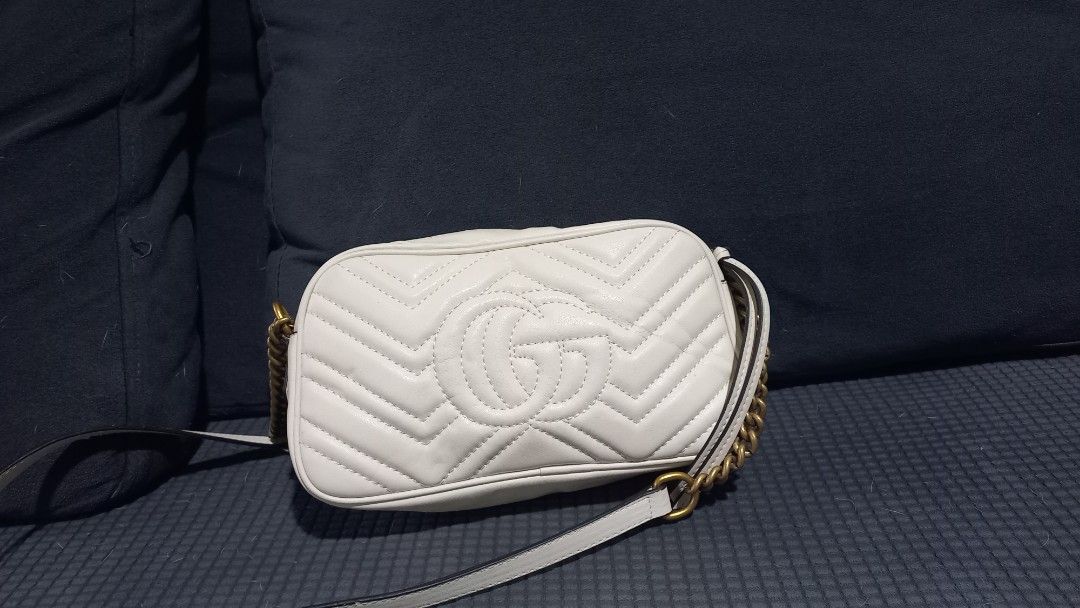 Gucci GG Marmont Mini Bag (Category: Luxury Bags & Wallets) located in Manila. Submitted by luckyrabbit.25 (Listing ID 1436303123, Image 2). Description: - Authentic Gucci GG Marmont mini bag - Color: White - Chevron pattern - Gold-tone GG logo - Chain strap - Beige lining - Zip closure.