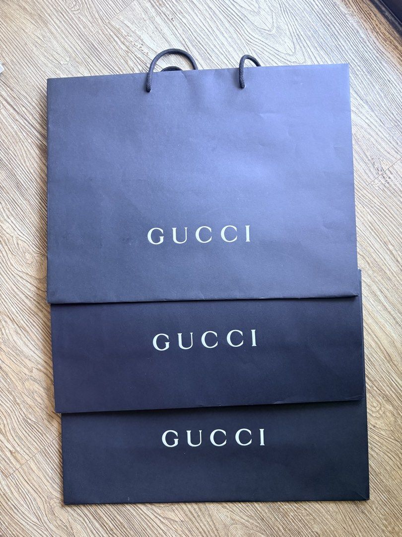 Gucci Paper Bag (Category: Luxury Bags & Wallets) located in Pasig City. Submitted by thetravellingguyinstyle (Listing ID 1436335580, Image 1). Description: - Gucci Paper bags - Original - 450 Each - 3 pcs. available - 19 x 14 inches Dimes - Perfect for gifting or storing your Gucci items.