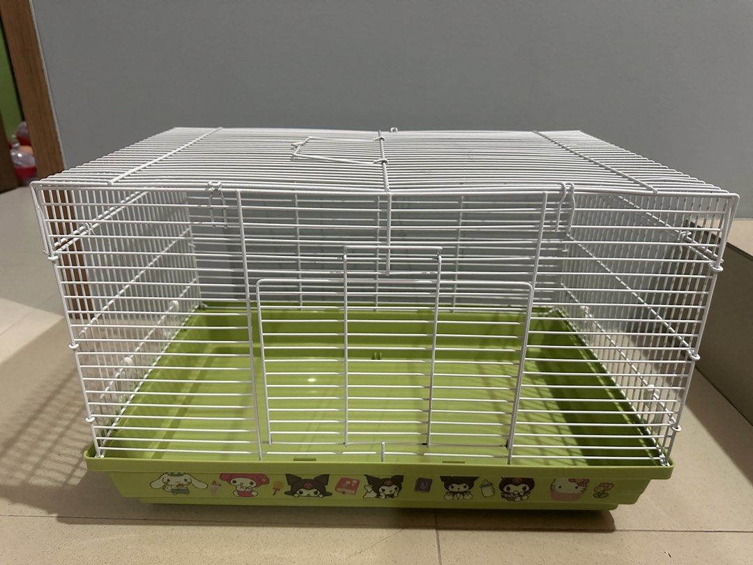 Hamster Cage with free toilet (Category: Homes & Other Pet Accessories) located in Caloocan City. Submitted by ashleyscorner (Listing ID 1436323414, Image 2). Description: - Hamster cage with white wire frame and green base. - Includes a small, yellow, enclosed accessory. - Features a top opening. - Attractive design on the base. - Suitable for small pets. size l-47 inches w-12inches h-12 inches.