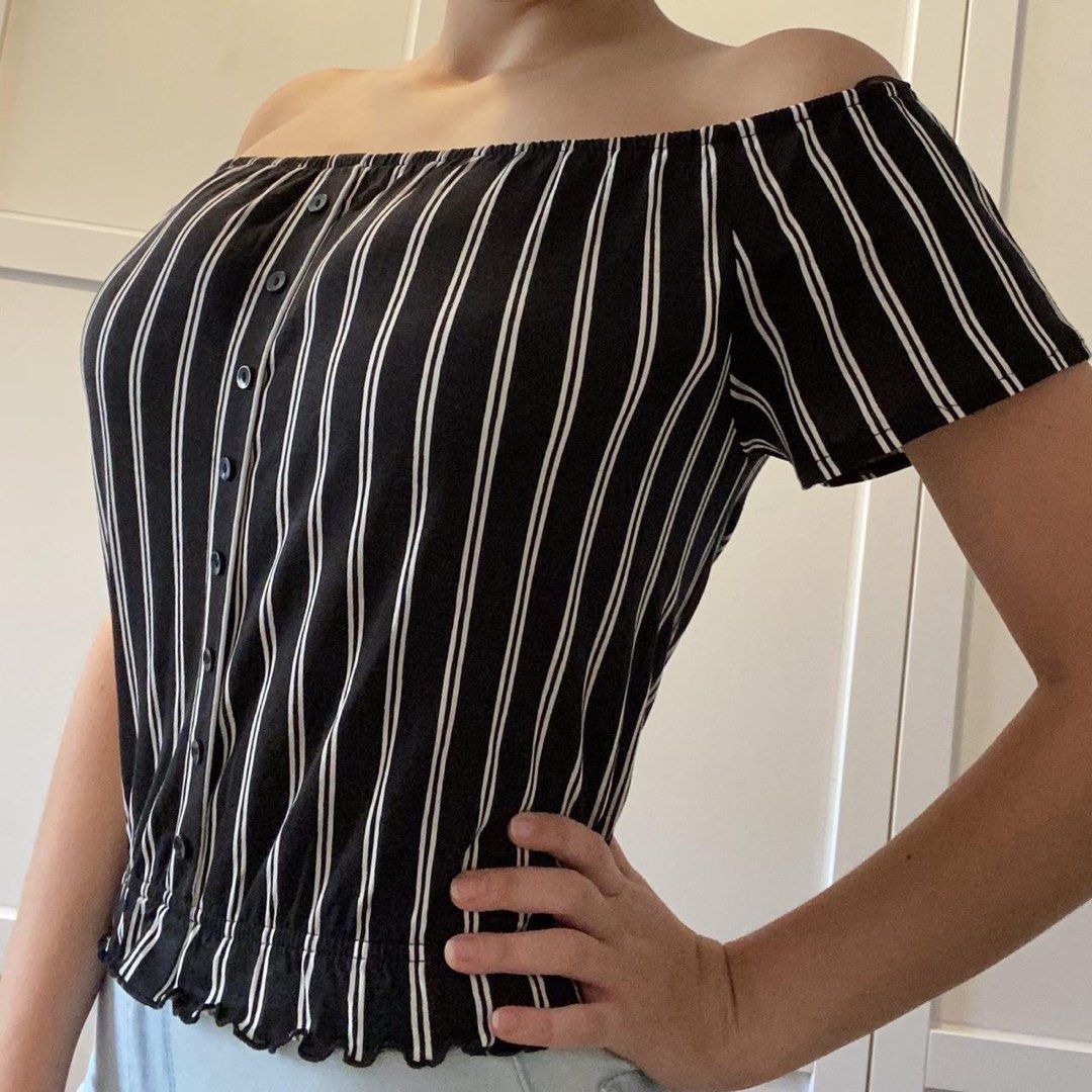 H&M Off Shoulder Top (Category: Blouses) located in Makati City. Submitted by sphpnd (Listing ID 1436463867, Image 1). Description: - H&M off-shoulder top - Black and white stripes - Size: XS - Features: Button-down front, elasticated hem - Fabric: Lightweight - Sleeves: Short - Suitable for warm weather.