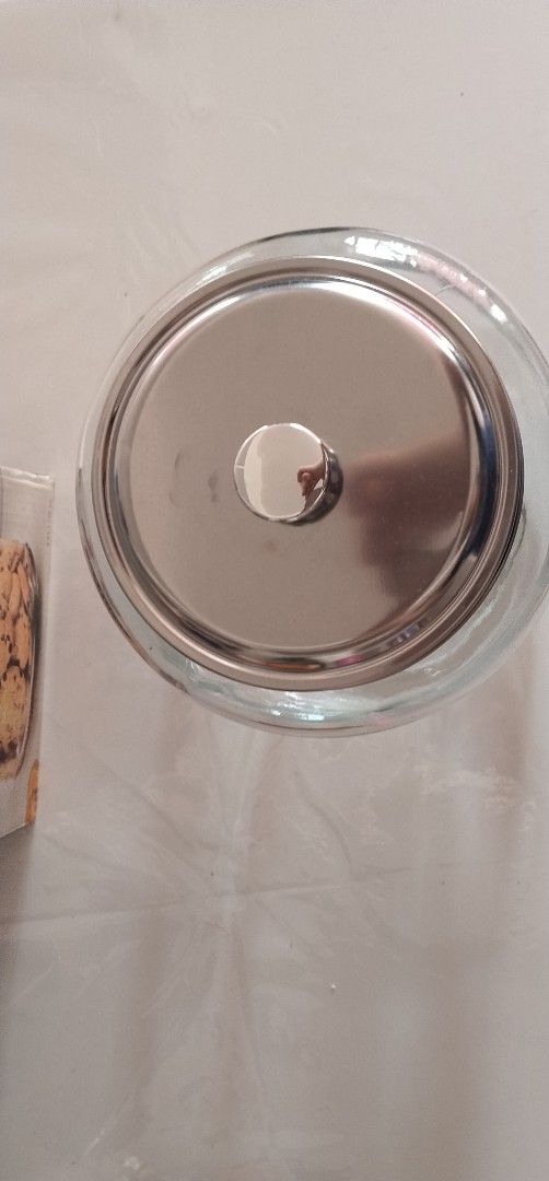 Home Basics Cookie Jar with Metal Lid (Category: Food Organization & Storage) located in Pasig City. Submitted by magsajokat46354 (Listing ID 1436299231, Image 3). Description: - Home Basics cookie jar - Clear glass design - Metal lid - Features a "Cookie" label - Heavy-duty, thick glass - never used with original box.