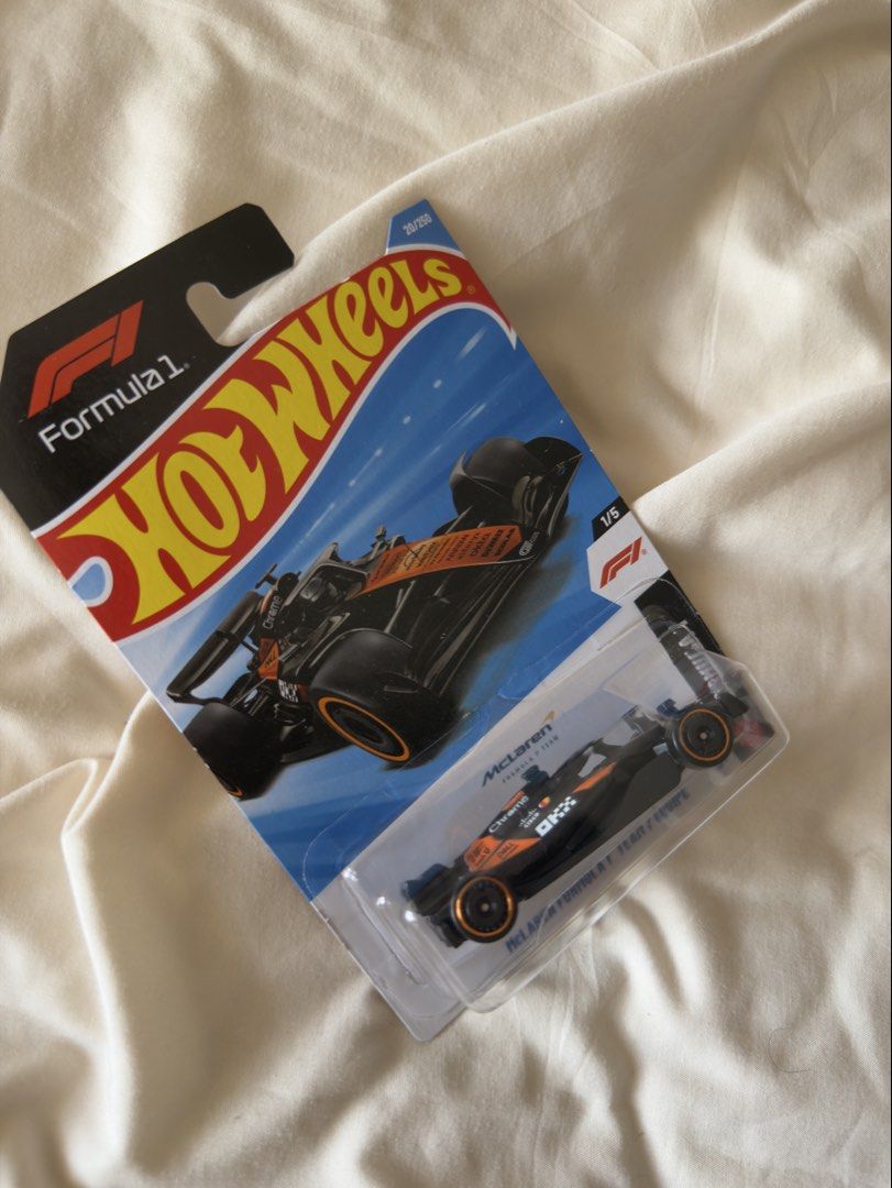 Hot Wheels McLaren Formula 1 Car (Category: Vehicle & Diecast Models) located in Manila. Submitted by sourcedbymissella_ (Listing ID 1436374305, Image 2). Description: - Hot Wheels McLaren Formula 1 diecast car - Color: Black and Orange - Part of the Formula 1 series (28/250) - 1/5 in the series - Features Hot Wheels and McLaren logos 600 + shipping fee shouldered by buyer no issues onhand 🤞🏻.