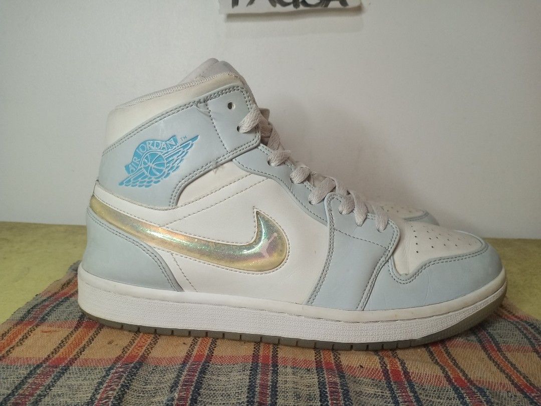 Jordan 1 Mid Glitter Swoosh - Size 8 (Category: Sneakers) located in General Santos City (Dadiangas). Submitted by michaelmp2026 (Listing ID 1436292447, Image 2). Description: - Jordan 1 Mid Glitter Swoosh - Size 8 - Color: Light blue and white - Features a glitter swoosh - Jordan logo on side and tongue - Made in Indonesia.