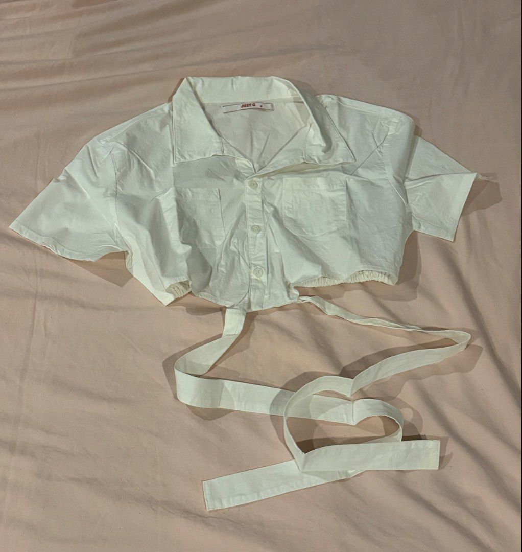Just G White Crop Top with Tie (Category: Others Tops) located in Masbate. Submitted by anjcbr (Listing ID 1436424763, Image 1). Description: - Just G white cropped top with tie - Used once only - Slight color variations on the photo due to lighting.