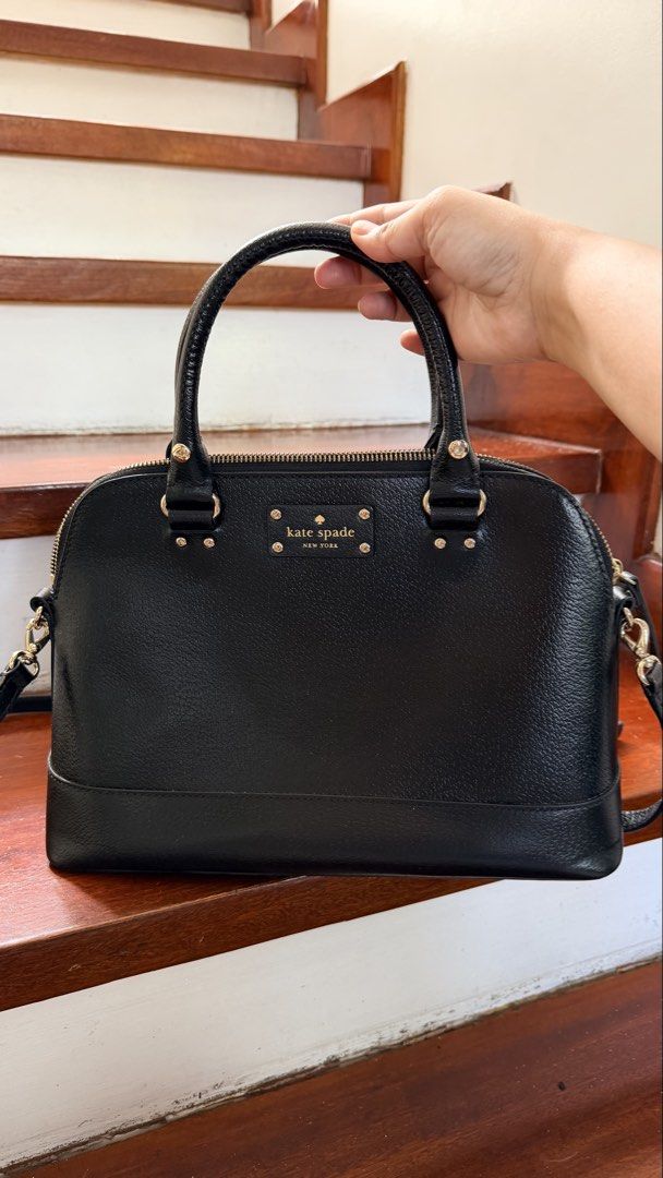 Kate Spade Black Dome Satchel Bag (Category: Luxury Bags & Wallets) located in Cainta. Submitted by aurahgem (Listing ID 1436393775, Image 2). Description: - Kate Spade black dome satchel bag - Top handle and detachable shoulder strap - Gold-tone zipper and hardware - Kate Spade logo detail - Made of textured leather.