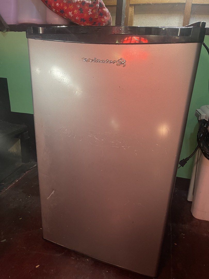 Kelvinator KPR62MN-R Mini Refrigerator (Category: Refrigerators and Freezers) located in Quezon City. Submitted by ejwolf (Listing ID 1436345721, Image 1). Description: - Kelvinator mini refrigerator, model KPR62MN-R - Silver exterior, white interior - Temperature control dial - Interior light - Includes warning label - Visible wiring diagram - In good working condition -Minimal scratches and one small dent due to usage -Accessories such as divid
