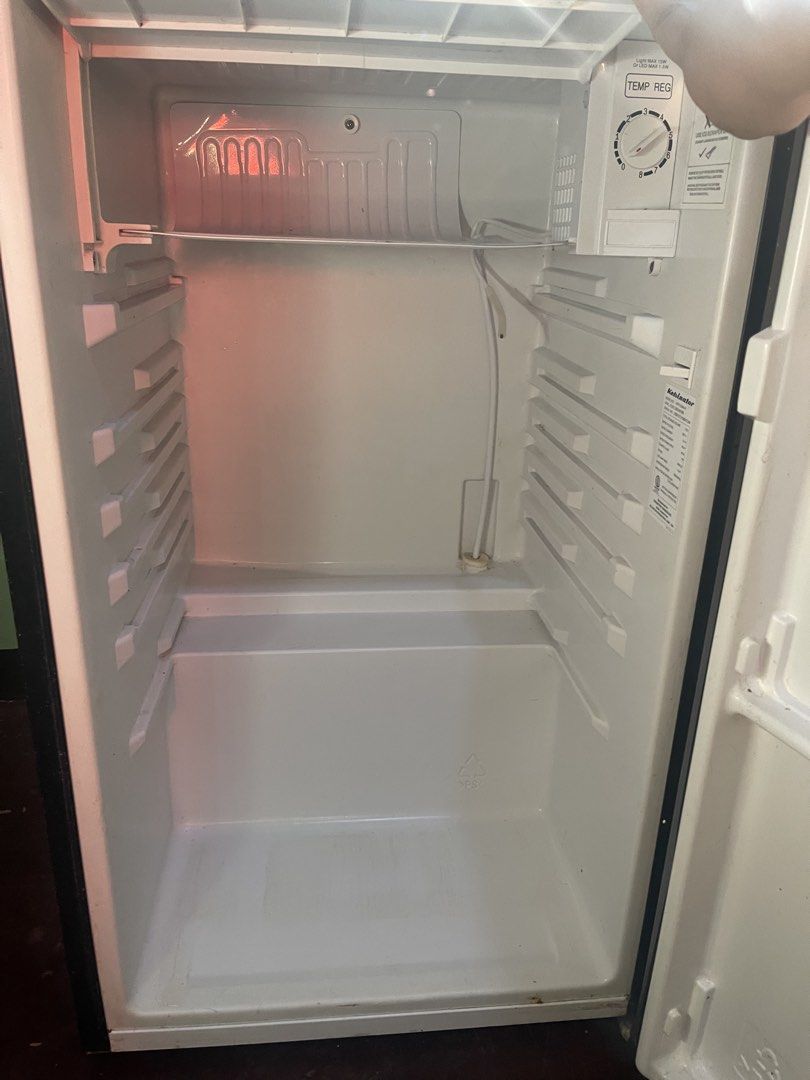 Kelvinator KPR62MN-R Mini Refrigerator (Category: Refrigerators and Freezers) located in Quezon City. Submitted by ejwolf (Listing ID 1436345721, Image 3). Description: - Kelvinator mini refrigerator, model KPR62MN-R - Silver exterior, white interior - Temperature control dial - Interior light - Includes warning label - Visible wiring diagram - In good working condition -Minimal scratches and one small dent due to usage -Accessories such as divid