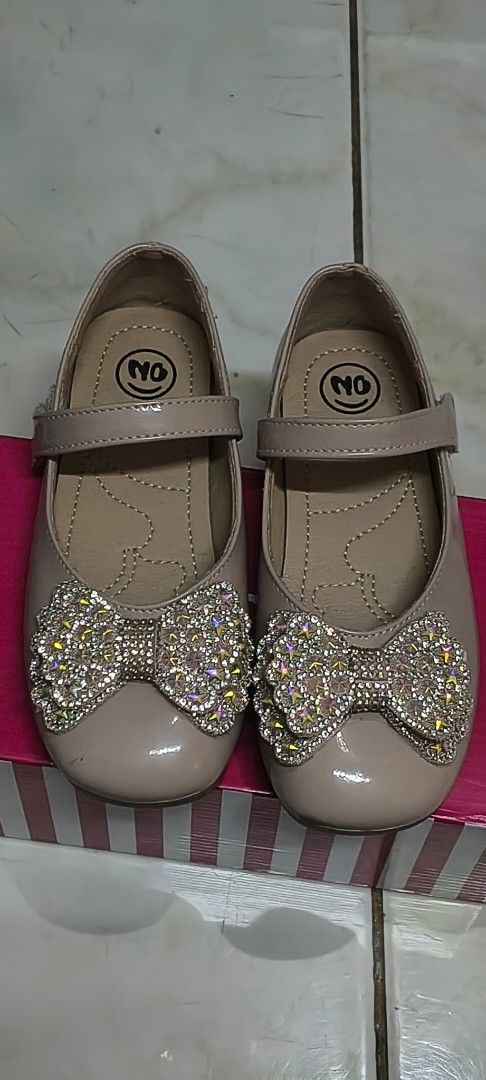 Kids Shoes Bundle Deal (Category: Babies & Kids Fashion) located in Pasig City. Submitted by lfboutique (Listing ID 1436294272, Image 3). Description: - Bundle of two pairs of kids' shoes . - Includes: - Black shoes: Perfect for school or formal events, easy strap closure. 19cm - Glitter bow shoes: Ideal for outings and special occasions.18cm - Price: ₱499 for both pairs..