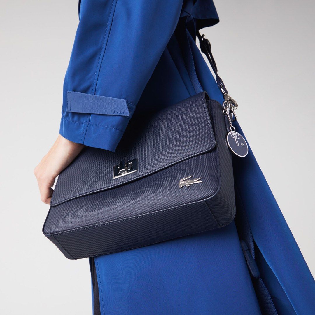 Lacoste Black Handbag (Category: Luxury Bags & Wallets) located in Quezon City. Submitted by camille96 (Listing ID 1436302253, Image 3). Description: - Black Lacoste handbag - Original price: 7,000 - Flap closure - Gold-toned clasp - Small Lacoste logo - Textured surface - Single handle .