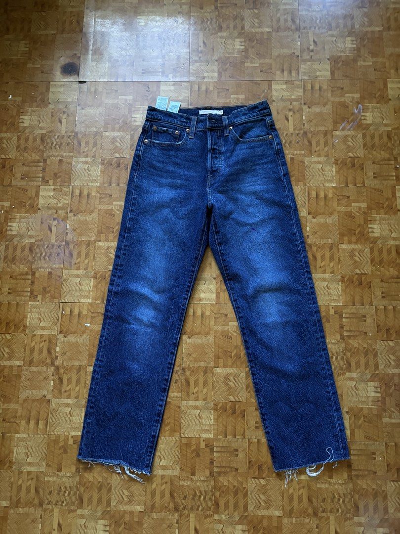 Levi's Wedge Straight Jeans Size 25 (Category: Jeans) located in Paranaque City. Submitted by eggnog852 (Listing ID 1436329928, Image 1). Description: Levi's Wedge Straight jeans in a dark wash. Features a classic five-pocket design with the Levi's leather patch on the back. The jeans have a straight leg cut with a raw hem.