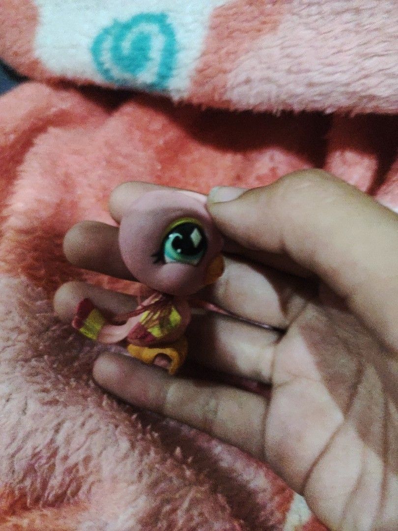 Littlest Pet Shop Pink Bird (Category: Kids Toys) located in Subic. Submitted by booley (Listing ID 1436377320, Image 3). Description: - Littlest Pet Shop bird toy - Pink with yellow and orange accents - Features large, expressive eyes - May be missing a part.