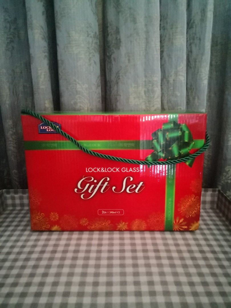 Lock & Lock Glass Jar Gift Set (Category: Dinnerware & Cutlery) located in Mandaluyong City. Submitted by ilovemyshop (Listing ID 1436415902, Image 2). Description: - 2 pcs 390 ml Jar with lid - Airtight food storage in clear glass - BPA free, microwave safe - Box adorned with floral designs.