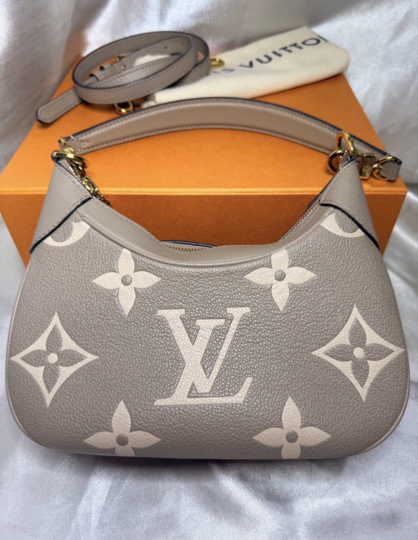 Louis Vuitton Bagatelle NM (Category: Luxury Bags & Wallets) located in Taguig. Submitted by aa_decluttering (Listing ID 1436420641, Image 1). Description: Louis Vuitton Bagatelle NM Material: Monogram Empreinte Giant (Embossed grained cowhide leather) • Color: Tourterelle / Dove (Bicolour) • Hardware: Gold-color hardware • Dimensions: 22 x 14 x 9 cm (Length x Height x Width) • Features: * Removable handle for hand or short-shoulder carry. • Remo