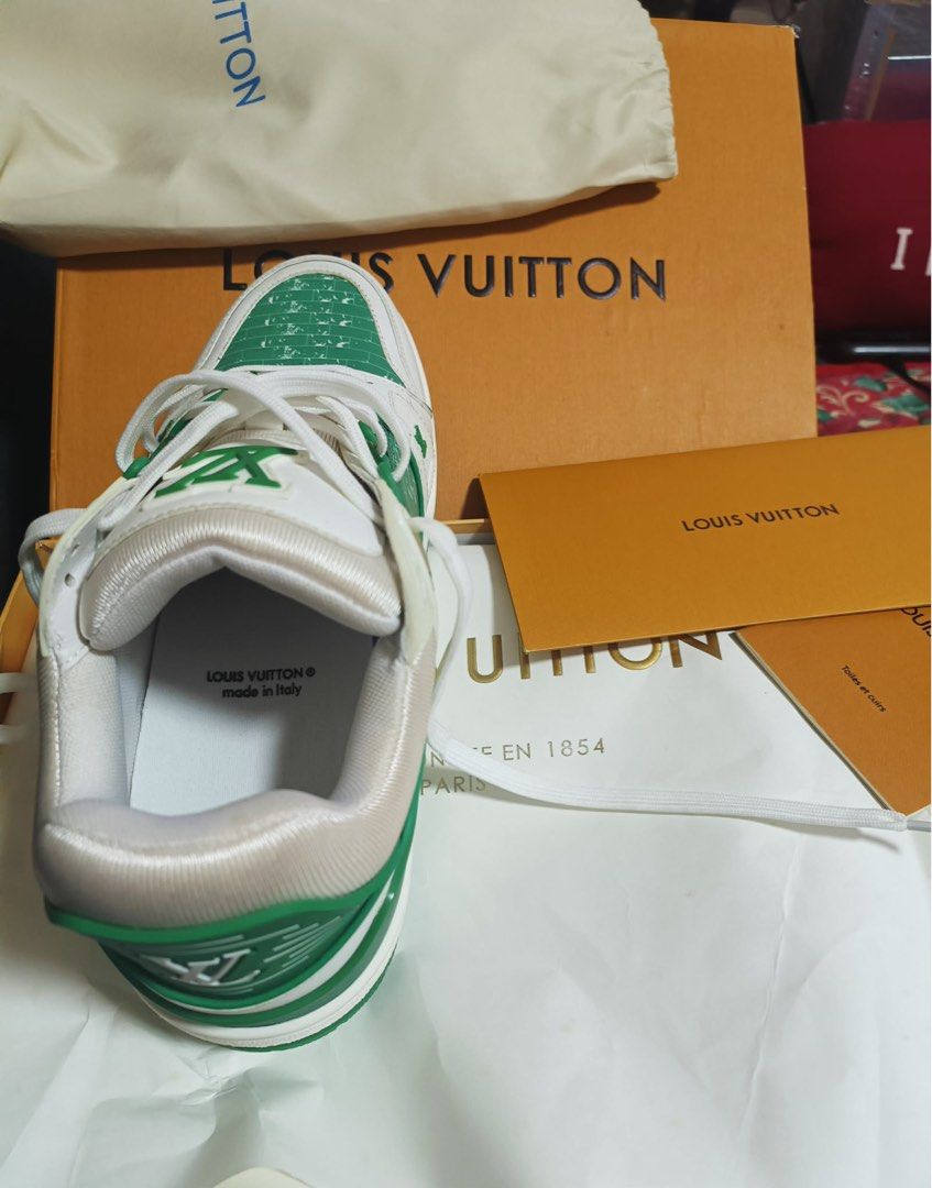 Louis Vuitton LV Trainer Green White Sneakers (Category: Sneakers) located in Paranaque City. Submitted by tinaascloset (Listing ID 1436296486, Image 3). Description: - Authentic Louis Vuitton LV Trainer sneakers - Color: Green and White - Includes original box, dust bag, and shopping bag - Made in Italy - Features LV logo on side and tongue - White laces - Green and white sole With certificate of authenticity .