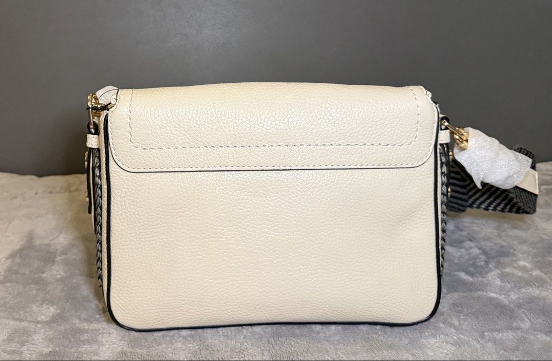 Marc Jacobs The Grove in Marshmallow (Category: Shoulder Bags) located in Cavite. Submitted by workingmom0827 (Listing ID 1436379483, Image 3). Description: Brand new, no issue A gleaming two-way zipper secures the convenient flap stash pocket of a compact leather crossbody bag. A woven crossbody strap brings a sporty finish to a hands-free style that’s perfect for everyday styling. 10 1/2”W x 8”H x 4”D Front flap closure Removable, adjustable cr