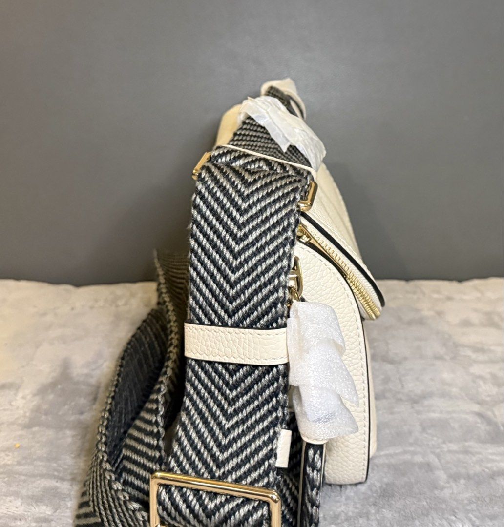 Marc Jacobs The Grove in Marshmallow (Category: Shoulder Bags) located in Cavite. Submitted by workingmom0827 (Listing ID 1436379483, Image 2). Description: Brand new, no issue A gleaming two-way zipper secures the convenient flap stash pocket of a compact leather crossbody bag. A woven crossbody strap brings a sporty finish to a hands-free style that’s perfect for everyday styling. 10 1/2”W x 8”H x 4”D Front flap closure Removable, adjustable cr