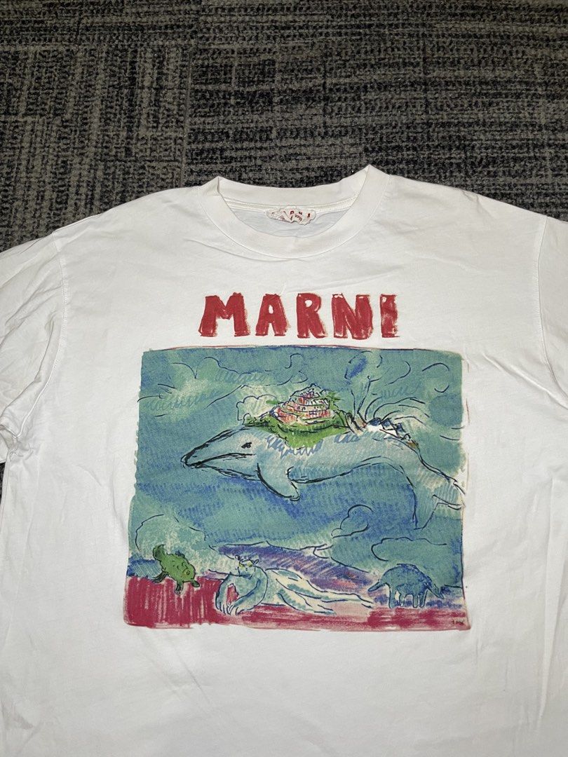 MARNI Graphic Print T-shirt (Category: Tshirts & Polo Shirts ) located in Taguig. Submitted by highlows (Listing ID 1436398294, Image 2). Description: - MARNI white T-shirt - Features a graphic print - Crew neck - Short sleeves - Made in Italy - Size 38 - Dimension: 20x25.