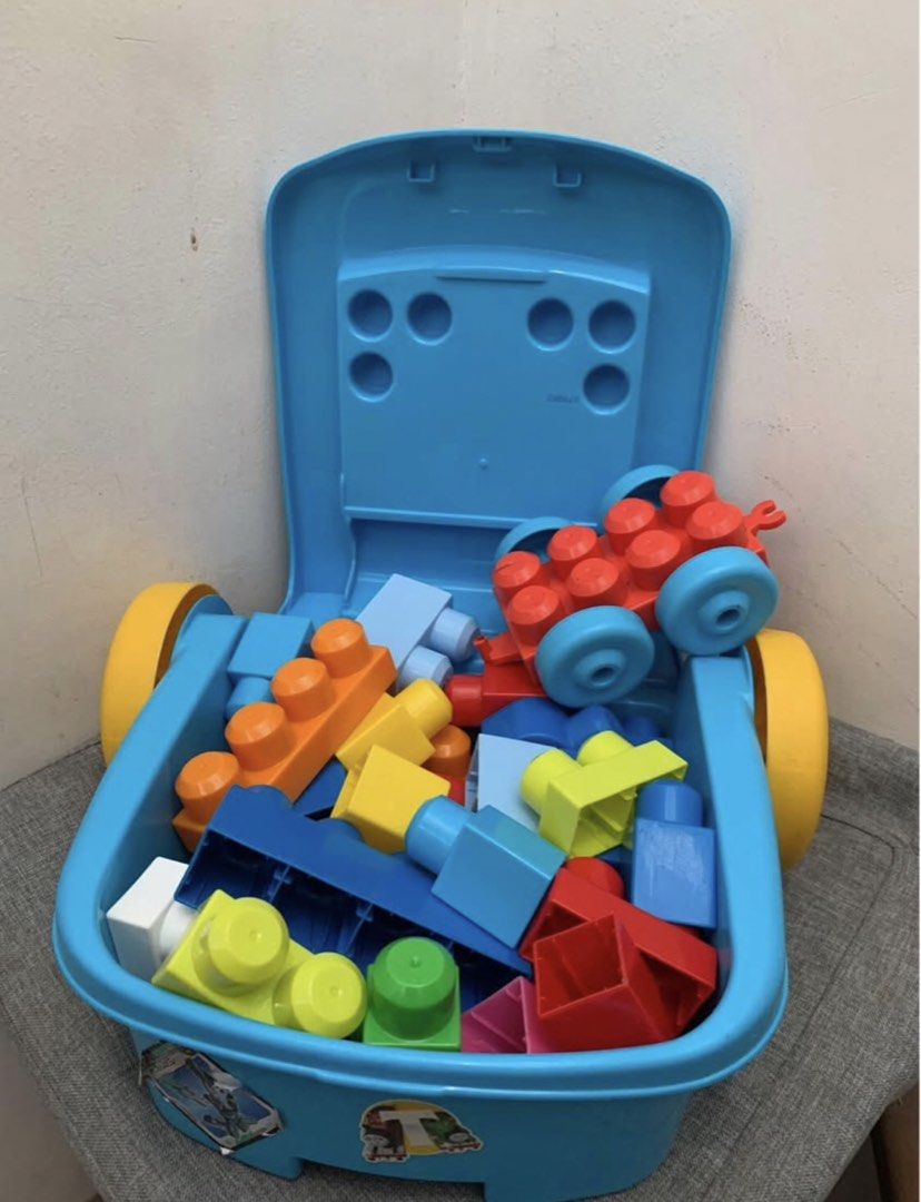 Mega Bloks Wagon with Blocks (Category: Lego & Building Sets) located in Imus. Submitted by plushfinds (Listing ID 1436340214, Image 2). Description: - Mega Bloks wagon with colorful blocks 50 + pcs - Features a handle for easy pushing/pulling - Includes a storage compartment Perfect for toddlers and young children.
