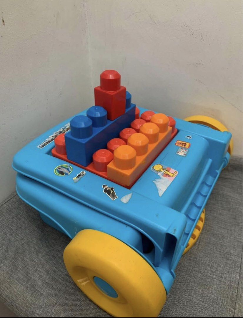 Mega Bloks Wagon with Blocks (Category: Lego & Building Sets) located in Imus. Submitted by plushfinds (Listing ID 1436340214, Image 3). Description: - Mega Bloks wagon with colorful blocks 50 + pcs - Features a handle for easy pushing/pulling - Includes a storage compartment Perfect for toddlers and young children.