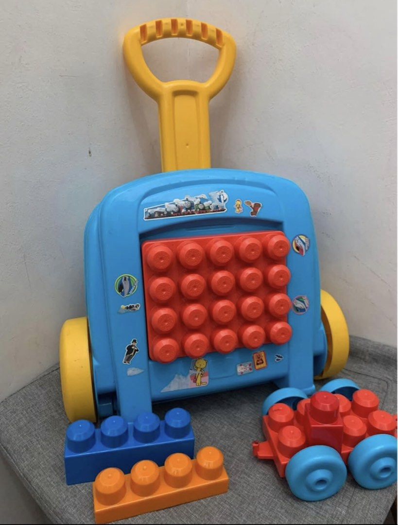 Mega Bloks Wagon with Blocks (Category: Lego & Building Sets) located in Imus. Submitted by plushfinds (Listing ID 1436340214, Image 1). Description: - Mega Bloks wagon with colorful blocks 50 + pcs - Features a handle for easy pushing/pulling - Includes a storage compartment Perfect for toddlers and young children.