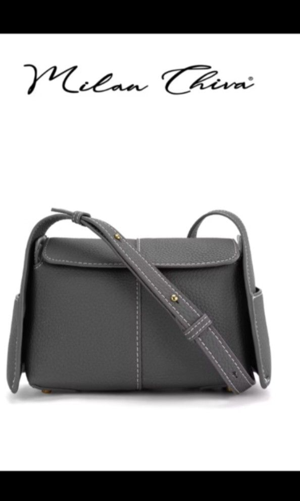 Milan Chiva Crossbody Bag (Category: Shoulder Bags) located in Pandi. Submitted by warmpuppy (Listing ID 1436395868, Image 1). Description: - Milan Chiva crossbody/ shoulder bag - Gray color - Rectangular shape - Flap closure -PU Leather - Long, adjustable strap - Two side pockets - Unique stitching detail on strap.