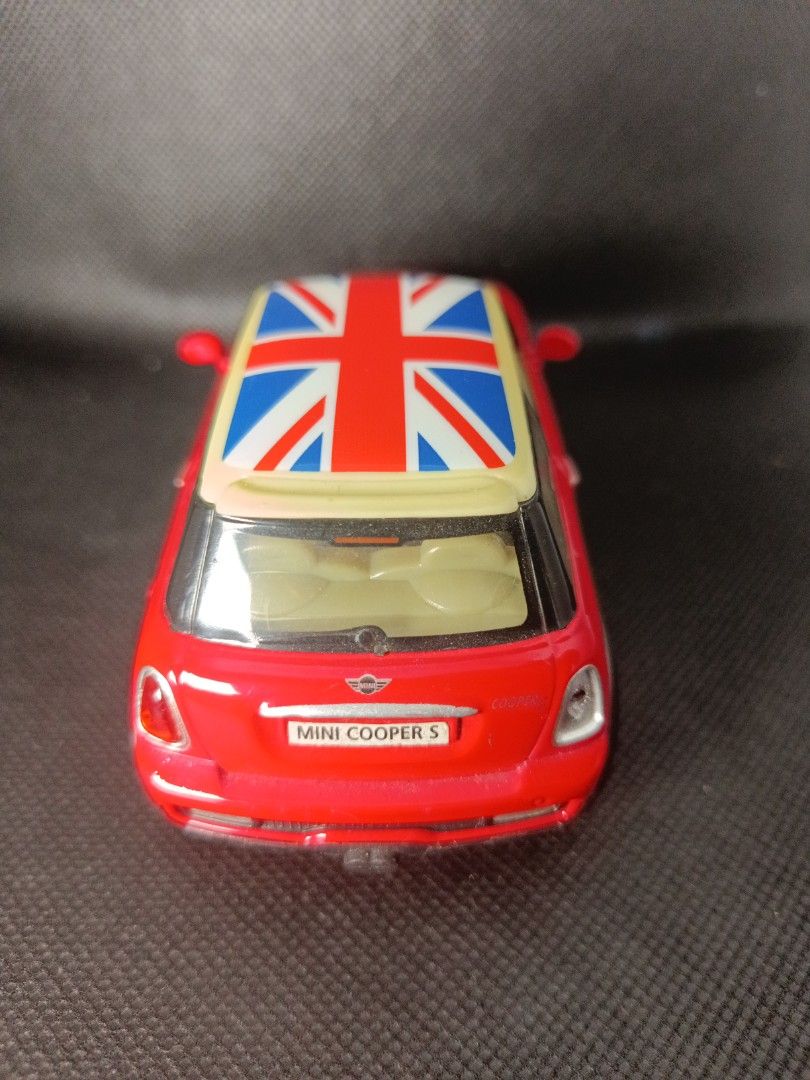 Mini Cooper S Toy Car (Category: Vehicle & Diecast Models) located in Baliuag. Submitted by yuyus_corner20 (Listing ID 1436383733, Image 3). Description: - Red Mini Cooper S toy car - Union Jack roof - White stripes on hood - Detailed interior - Silver wheels - Miniature replica -licensed by BMW -scale 1:30 -dated 2012.