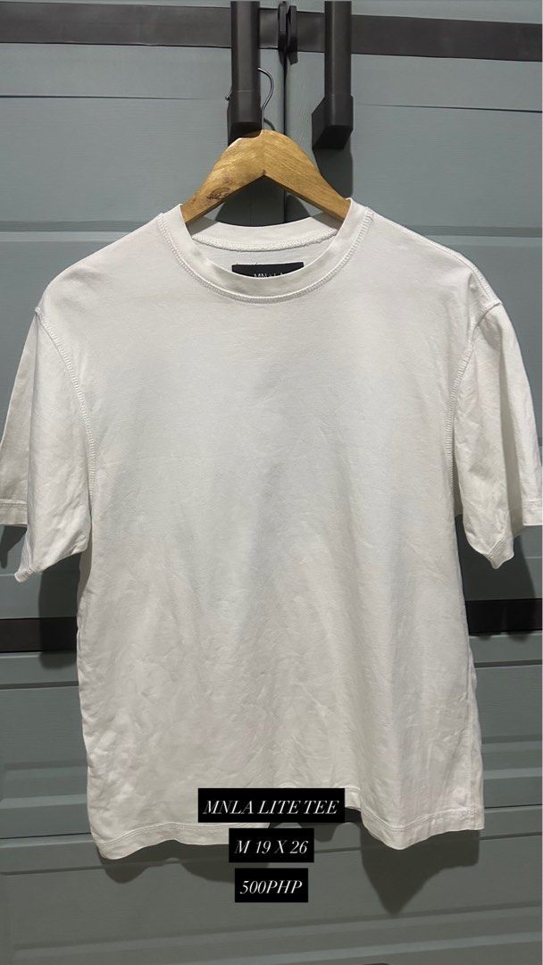 MNLA Lite Tee - White (Category: Tshirts & Polo Shirts ) located in Manila. Submitted by torioleejw25315 (Listing ID 1436349080, Image 1). Description: - MNLA Lite Tee - Color: White - Style: Crew neck, short sleeves - Size: M (19x26) - Perfect for casual wear - Versatile for layering.