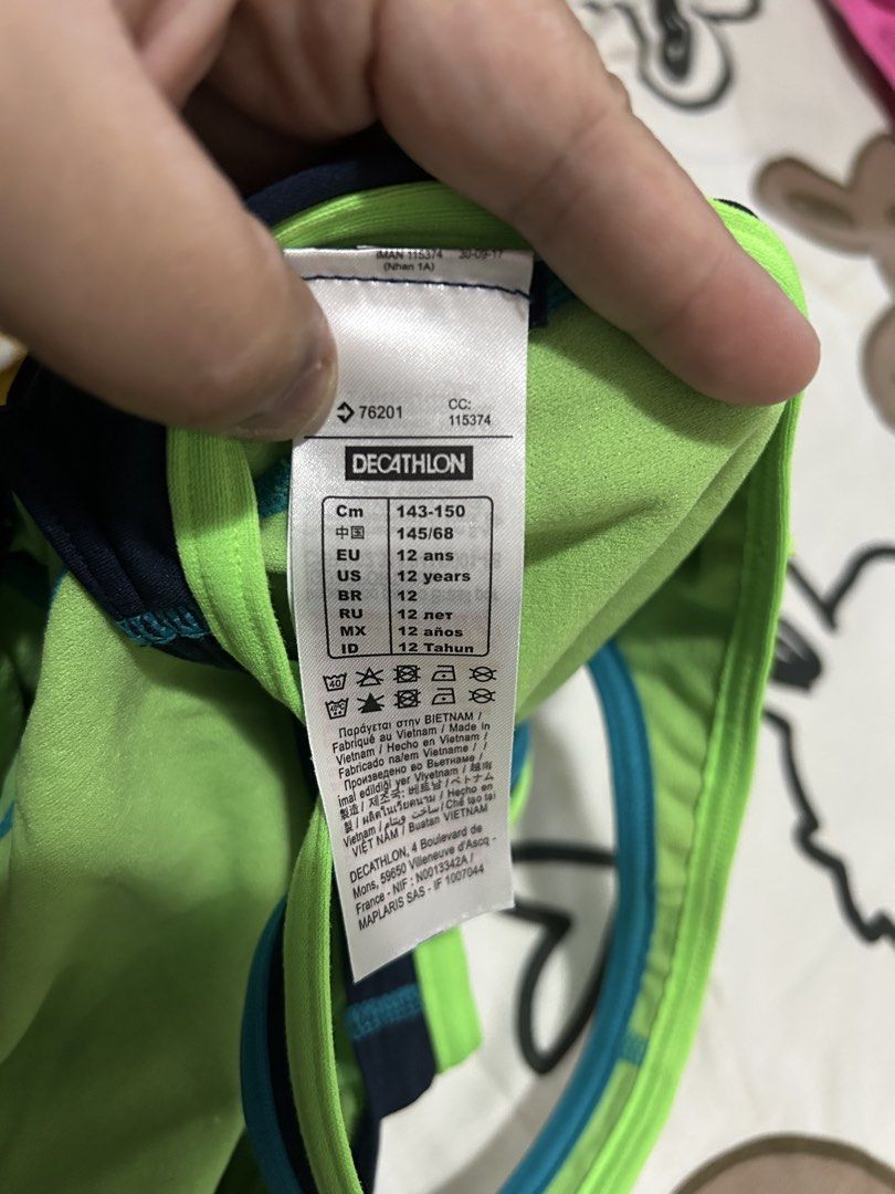 Nabaiji Swimsuit, 12y (Category: Babies & Kids Fashion) located in Paranaque City. Submitted by allthatclutterph (Listing ID 1436396005, Image 3). Description: - Nabaiji swimsuit - Color: Navy blue with green and teal accents - Designed for 12-year-olds (143-150 cm) - Racerback style - Features the Nabaiji logo - Made in Vietnam.