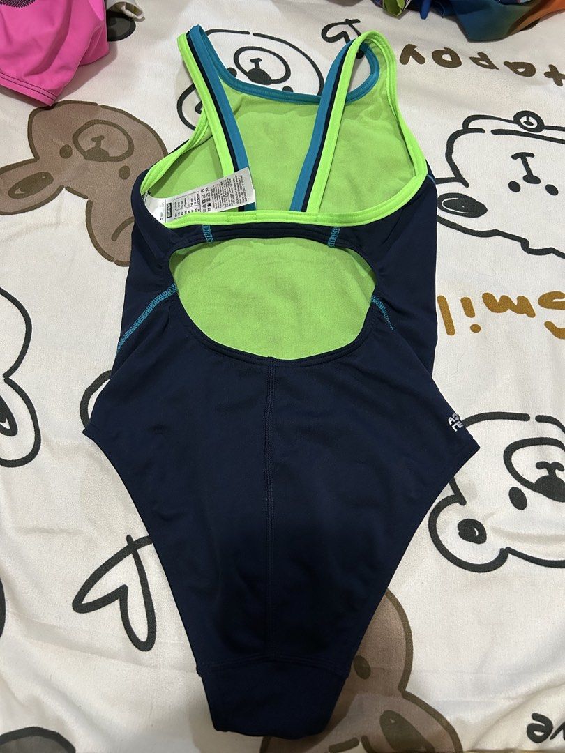 Nabaiji Swimsuit, 12y (Category: Babies & Kids Fashion) located in Paranaque City. Submitted by allthatclutterph (Listing ID 1436396005, Image 2). Description: - Nabaiji swimsuit - Color: Navy blue with green and teal accents - Designed for 12-year-olds (143-150 cm) - Racerback style - Features the Nabaiji logo - Made in Vietnam.