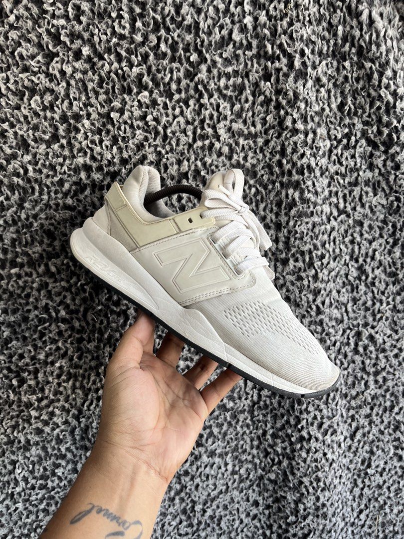 New Balance 247 | Size 9.5 mens (Category: Sneakers) located in General Trias. Submitted by zrchustle.604 (Listing ID 1436374949, Image 1). Description: a New Balance 247, specifically a version often identified by the model number MS247EW. This particular model is known for its "24/7" lifestyle design, featuring a predominantly white or cream colorway with a breathable mesh upper. Key Features Midsole Technology: The shoe features a REVlite mids