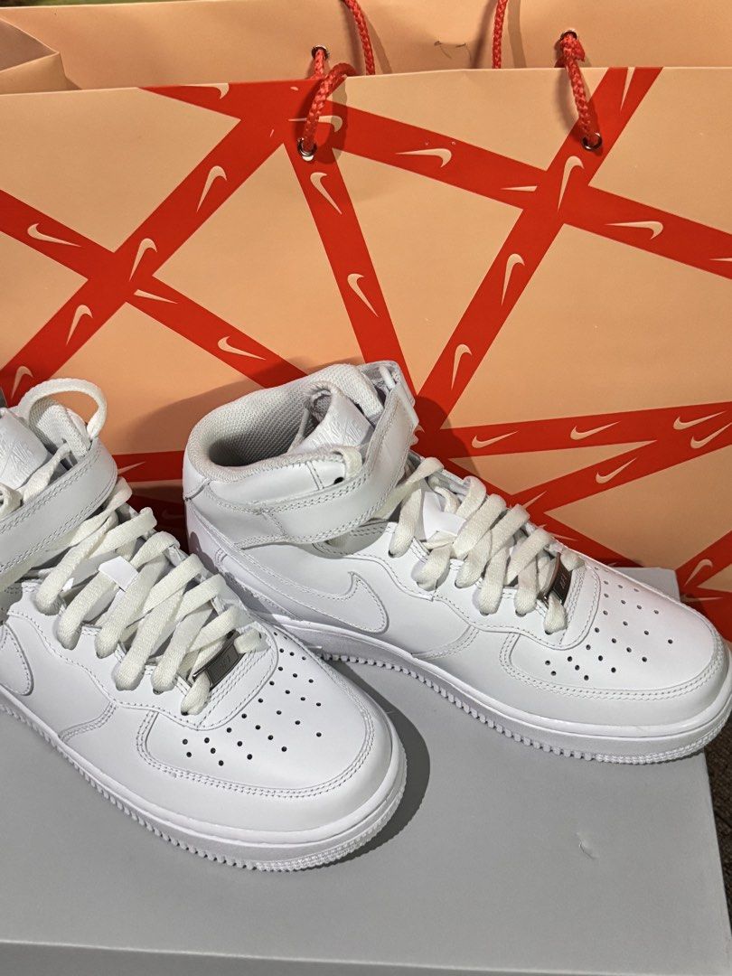 Nike Air Force 1 '07 Mid White Sneakers (Category: Sneakers) located in Obando. Submitted by pepperooshop (Listing ID 1436301793, Image 1). Description: - Nike Air Force 1 '07 Mid - White colorway - Size: US 7.5, UK 5, EUR 38.5 - Mid-top design with strap closure.