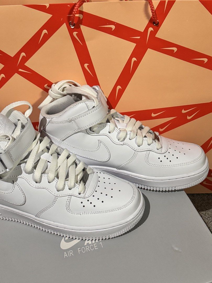 Nike Air Force 1 '07 Mid White Sneakers (Category: Sneakers) located in Obando. Submitted by pepperooshop (Listing ID 1436301793, Image 2). Description: - Nike Air Force 1 '07 Mid - White colorway - Size: US 7.5, UK 5, EUR 38.5 - Mid-top design with strap closure.