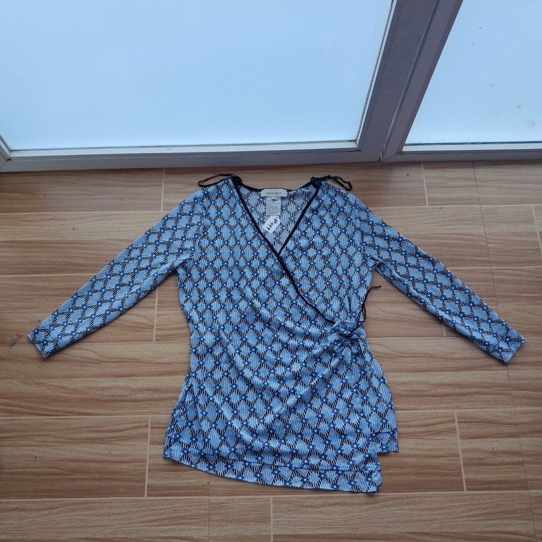 Nine West geometric mesh surplice top in blue (Category: Blouses) located in Digos. Submitted by richcaliforniaclothingstore (Listing ID 1436366233, Image 2). Description: ☆Color may vary due to lighting. Size:Large on tag(Length 25inches|Width 15inches Limited stock only kaya get na! Open for lay away pm for more info..