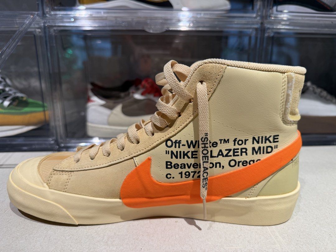 Off-White x Nike Blazer Mid (Category: Sneakers) located in Quezon City. Submitted by declutterqueenhigh5 (Listing ID 1436468419, Image 1). Description: - Off-White x Nike Blazer Mid sneakers - Cream and orange color scheme - Signature Off-White text detail - "SHOELACES" printed on laces - Orange Nike swoosh - High-top design - Cream sole -NEVER USED.