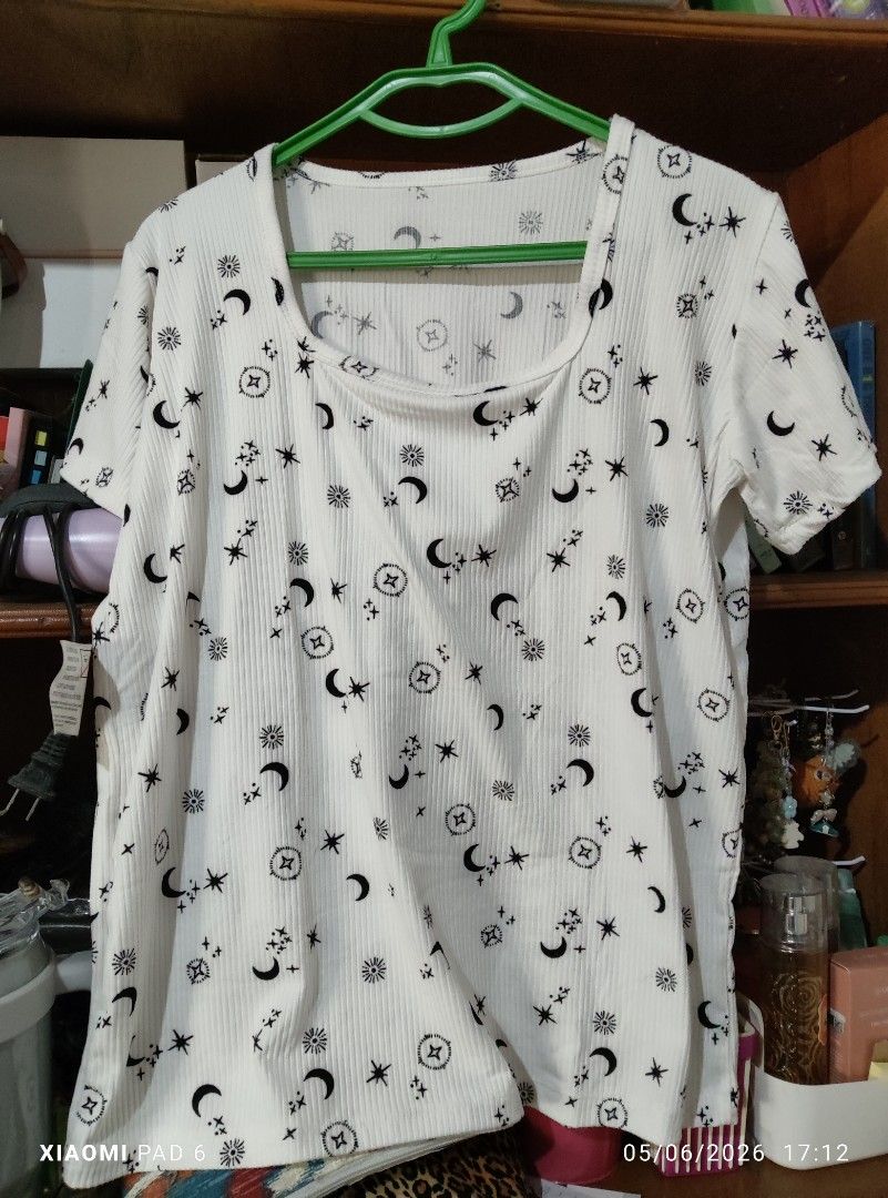 Pambahay shirts fits (L-XL) {50php each} (Category: Shirts) located in Pila. Submitted by heyz27 (Listing ID 1436378209, Image 1). Description: - Celestial print ribbed t-shirts - Unique sun, moon, and star design - Available colors: White and Blue - Features a scoop neck - Short sleeves - Perfect for casual wear.