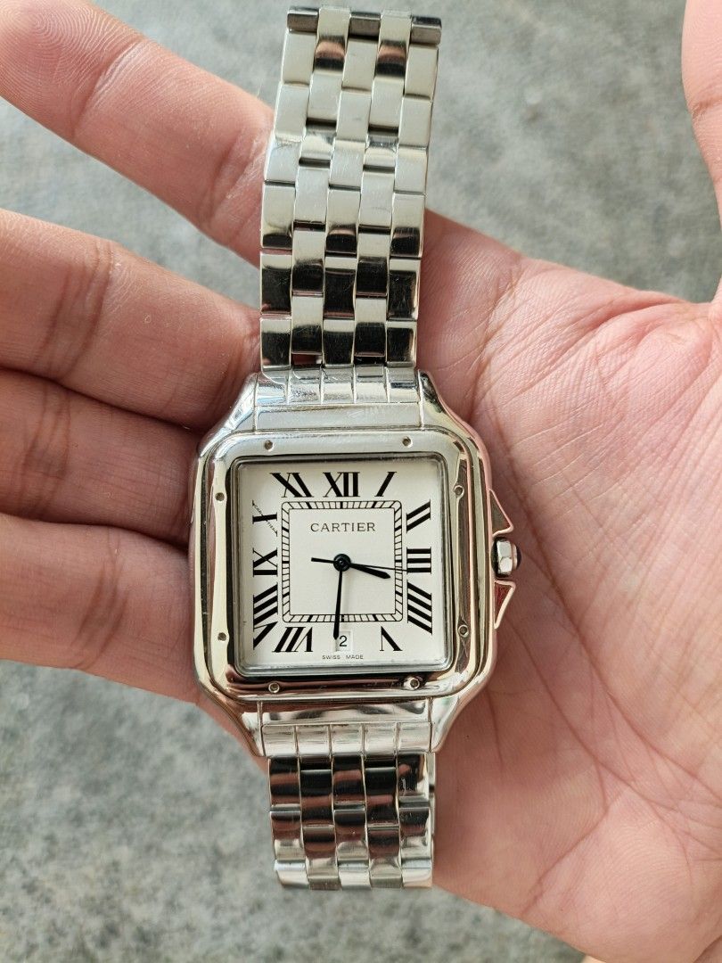 Panther Watch (Category: Luxury Watches) located in Cainta. Submitted by luxurypreloved2022 (Listing ID 1436357499, Image 1). Description: - Panther watch - Stainless steel case and bracelet - Square white dial - Black Roman numeral hour markers - Blue hands - Blue stone crown - Folding clasp - Water resistant Just extra links, no box.