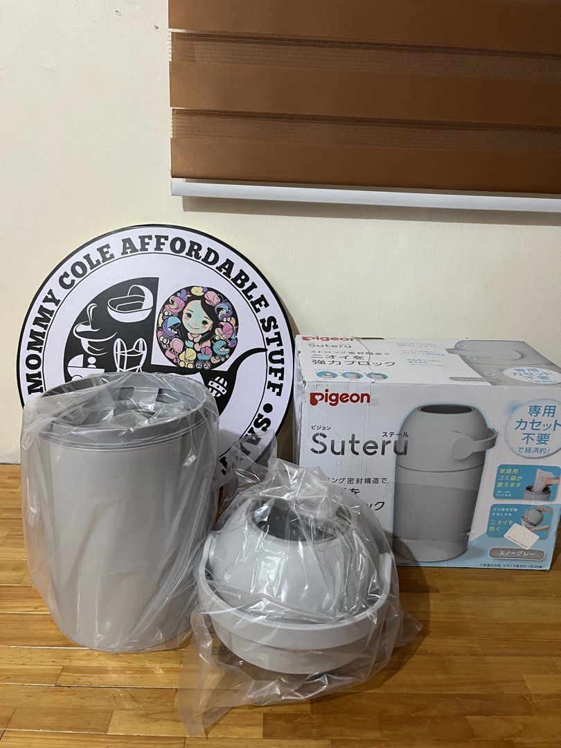 Pigeon Suteru Diaper bin (Category: Diapers & Baby Wipes) located in Santa Rosa. Submitted by mommy.cole.affordable.stuff (Listing ID 1436296173, Image 2). Description: Pigeon Suteru diaper disposal system. Features a strong sealing structure to block odors. The box includes the disposal unit, and instructions. The unit is in a light gray color. The box indicates that it does not require a special cassette. The unit is designed to be easy to use 