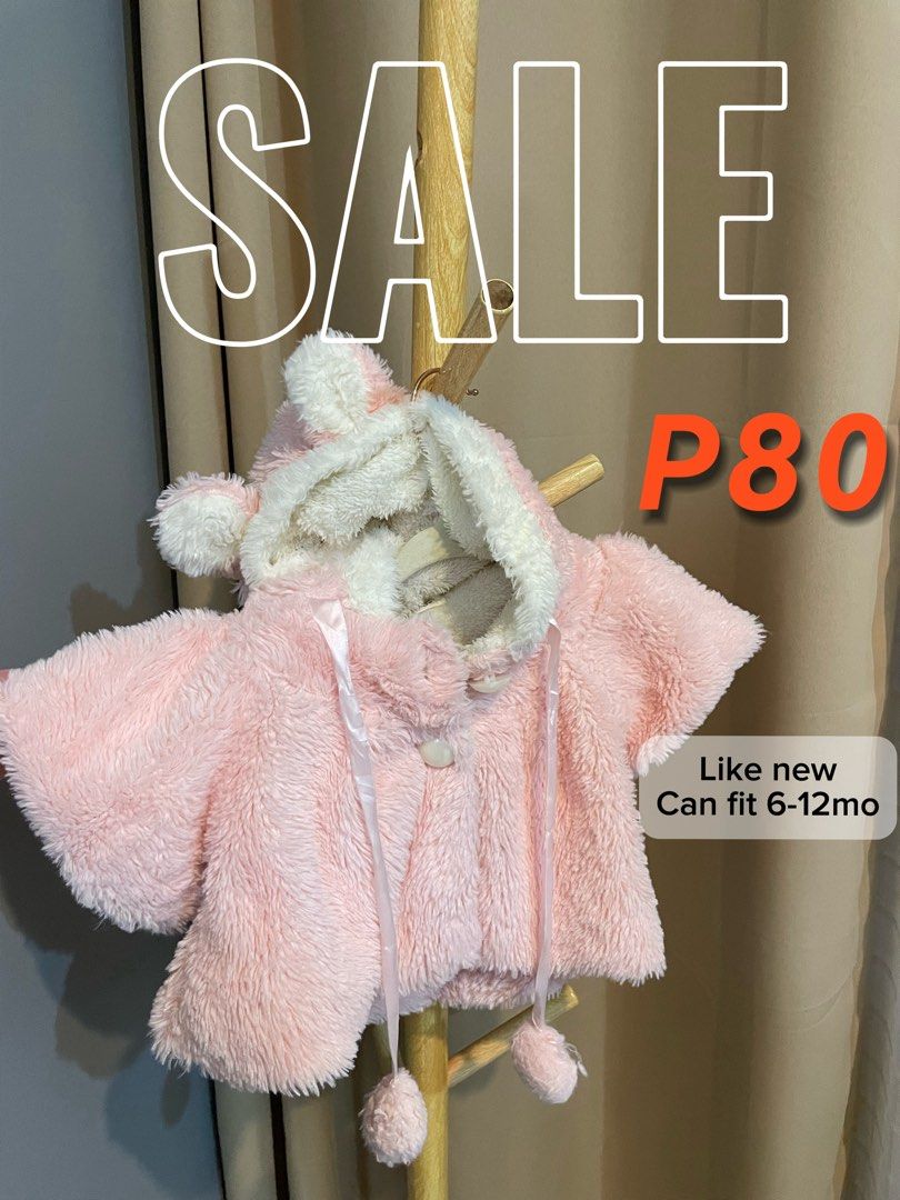 Pink Baby Cape with Hood (Category: Babies & Kids Fashion) located in Caloocan City. Submitted by gorgzel (Listing ID 1436361466, Image 1). Description: - Adorable pink baby cape - Features a hood with cute ear details - Soft and fluffy texture - Button closure and ribbon ties - Suitable for babies aged 6-12 months - Keeps your baby warm and cozy.