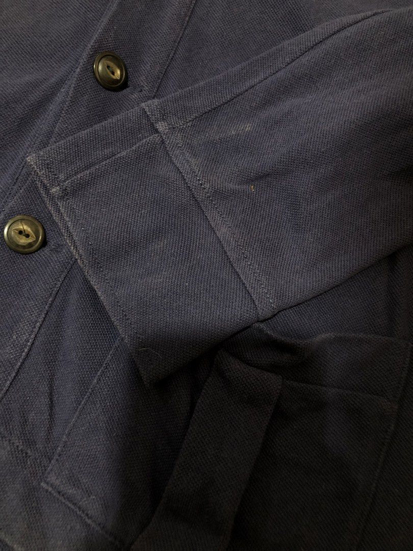 Polo Ralph Lauren Navy Cardigan (Category: Coats, Jackets and Outerwear) located in Manila. Submitted by yocsthrifted (Listing ID 1436308076, Image 3). Description: - Polo Ralph Lauren navy cardigan - Features a large white polo player logo - V-neck and button closure - Two front pockets - Button details on sleeves - Minor stains on sleeves - Size tag visible in photos.