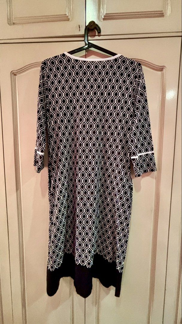 Printed Dress Polyester Fabric L-XL (Category: Dresses) located in Manila. Submitted by daisiestuffph (Listing ID 1436361022, Image 2). Description: - Polyester fabric - Black and white geometric pattern - V-neckline - White trim on sleeves and neckline - Knee-length - Black hemline - Size: L-XL.