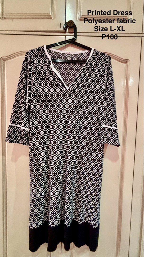 Printed Dress Polyester Fabric L-XL (Category: Dresses) located in Manila. Submitted by daisiestuffph (Listing ID 1436361022, Image 1). Description: - Polyester fabric - Black and white geometric pattern - V-neckline - White trim on sleeves and neckline - Knee-length - Black hemline - Size: L-XL.