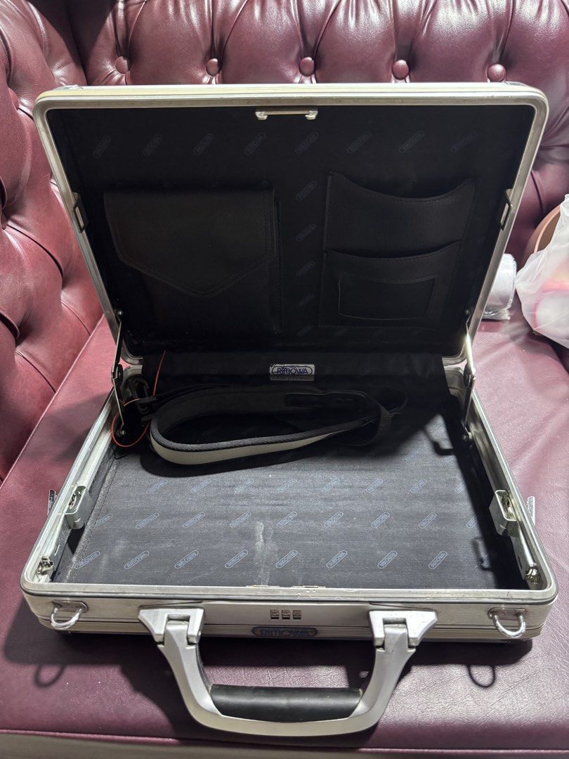 Rimowa Aluminum Briefcase (Category: Briefcases) located in Paranaque City. Submitted by destineshoppe (Listing ID 1436453220, Image 2). Description: - Authentic Rimowa aluminum briefcase - Silver exterior - Combination lock - Interior with multiple pockets and strap .